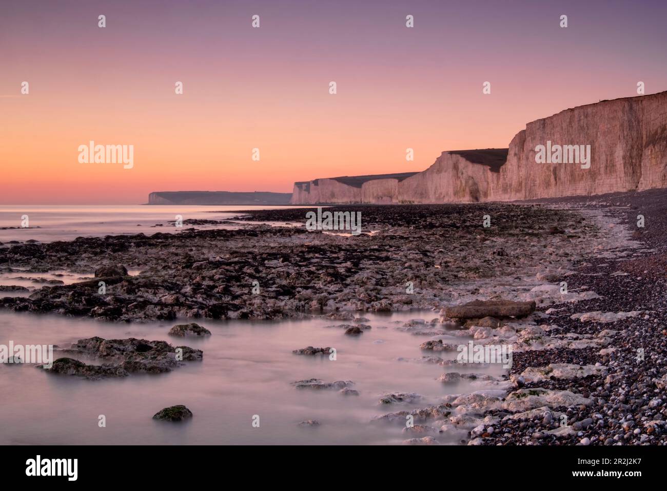 The Seven Sisters white chalk cliffs at sunset, Birling Gap, South Downs National Park, East Sussex, England, United Kingdom, Europe Stock Photo