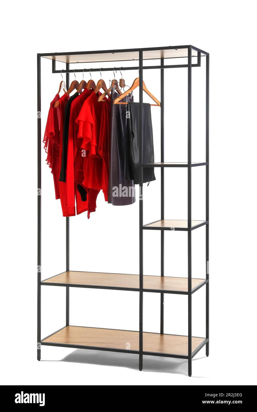 Shelving unit with clothes on white background Stock Photo Alamy