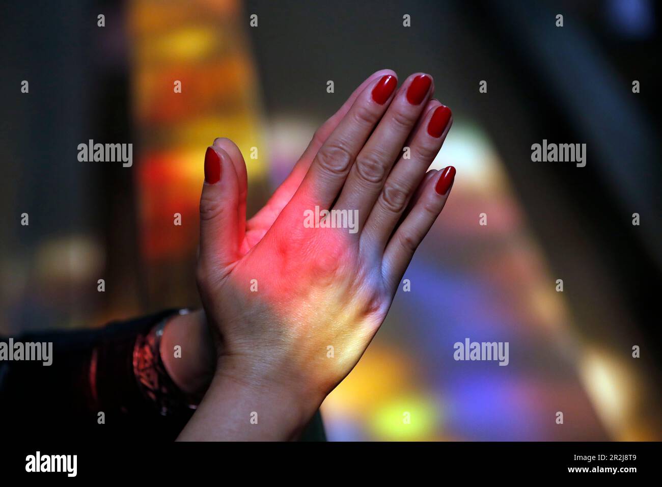 Close up of hands of woman praying in a church, Turckheim, France, Europe Stock Photo
