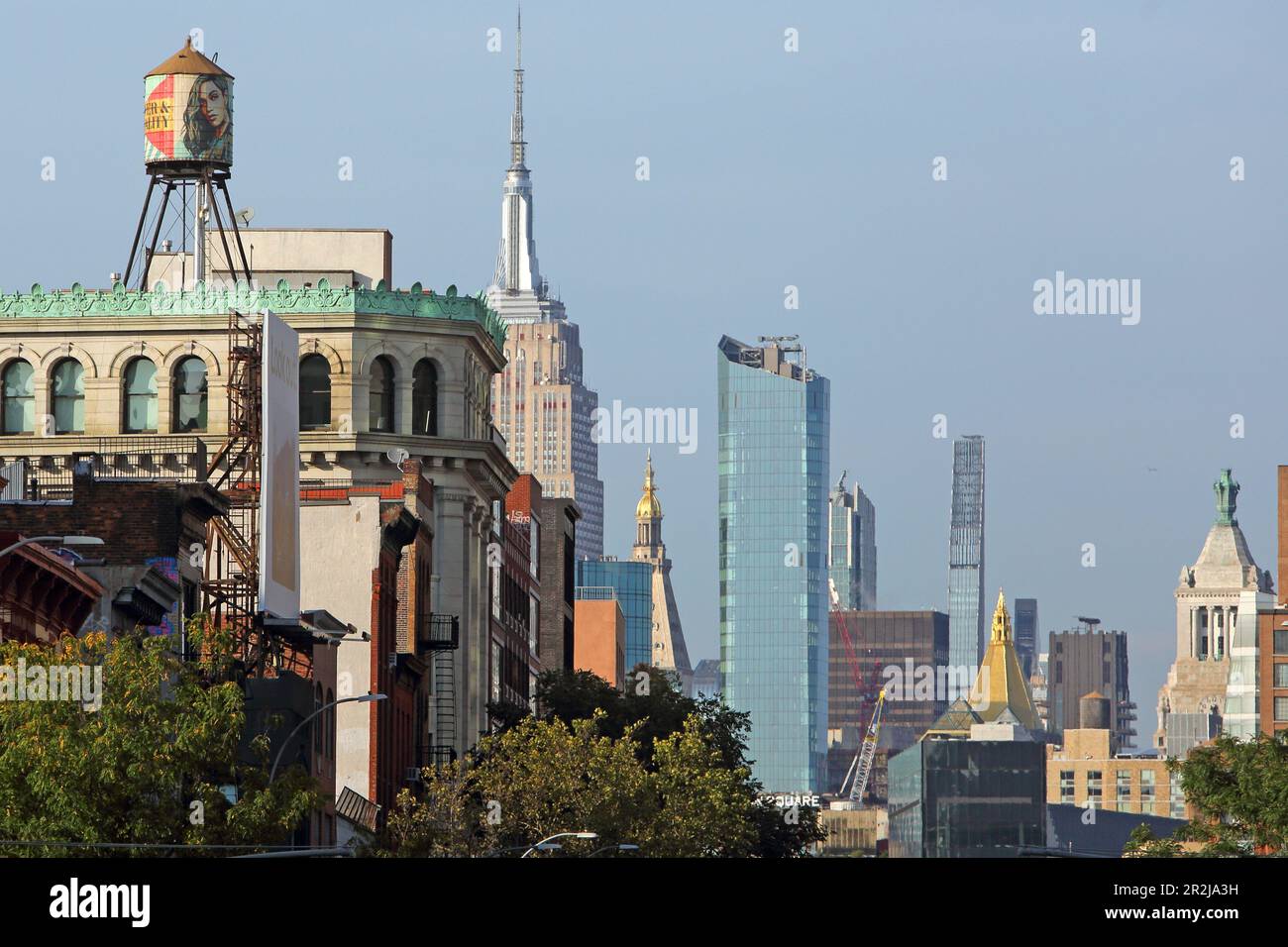 View of the Midtown Manhattan skyline with the Empire State Building from Bowery Street, Manhattan, New York, New York, USA Stock Photo