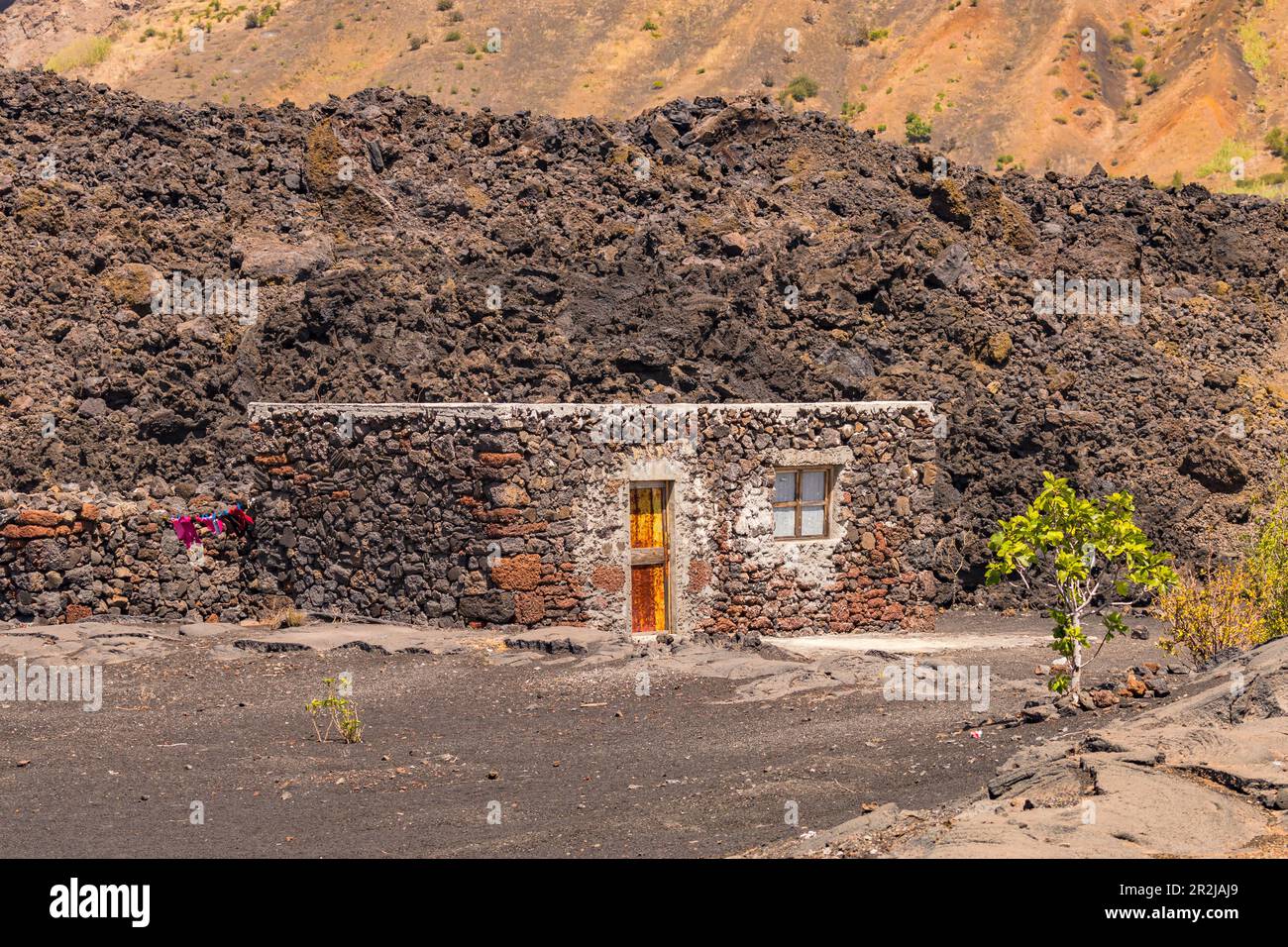 A simple little stone house on the edge of the lava flow in the crater of Pico do Fogo, Cape Verde Stock Photo