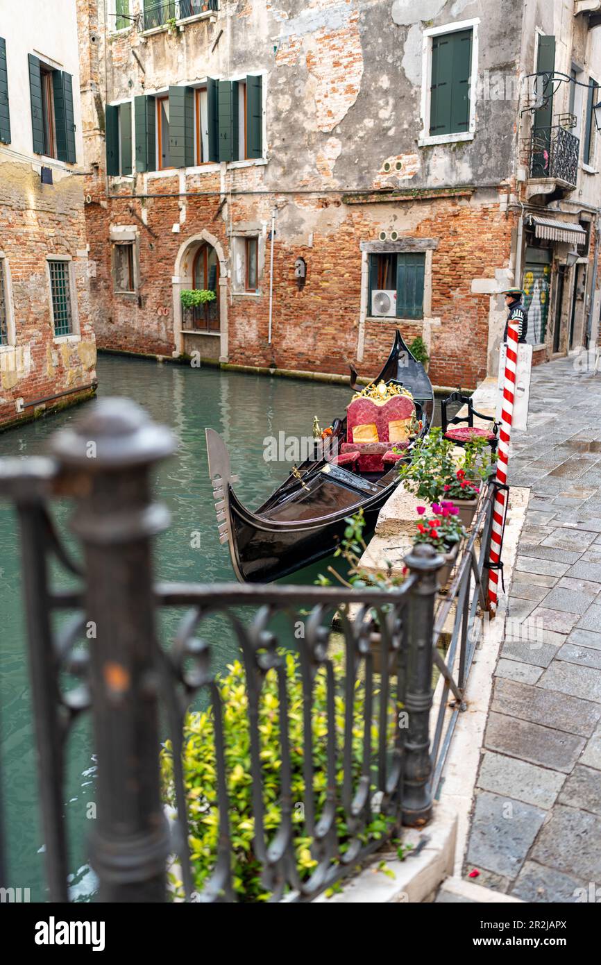 Venice - water alley with gondola, bridge and railing Stock Photo - Alamy