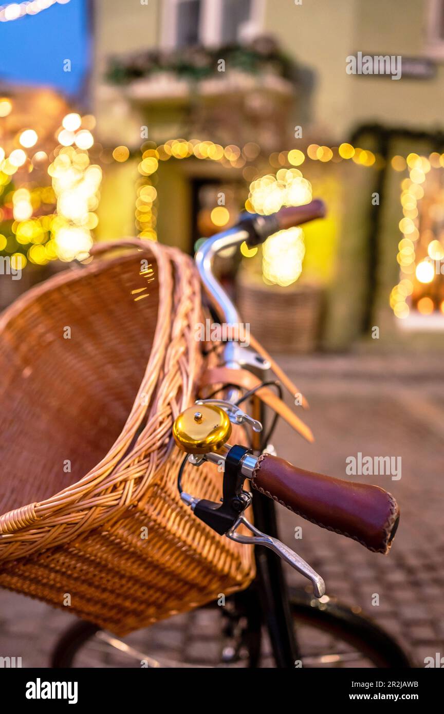 Nostalgic bicycle handlebars with basket and bell in downtown