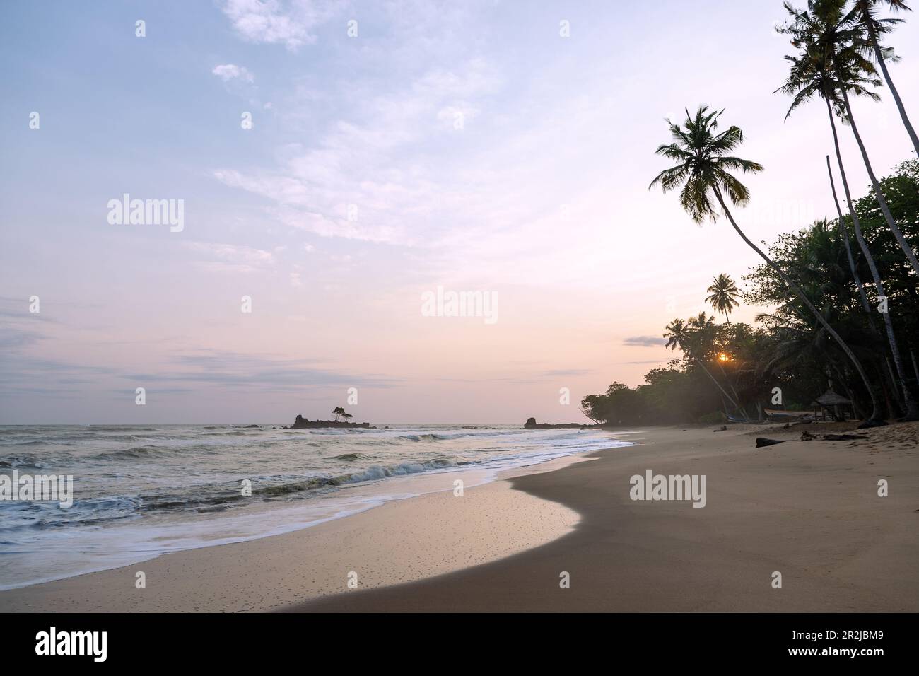 Ankroba Beach with sunset at Axim on the Gold Coast in the Western Region in western Ghana in West Africa Stock Photo