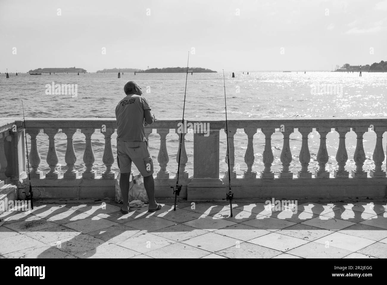 View of a fisherman in the Venice Lagoon, Venice, Veneto, Italy, Europe Stock Photo