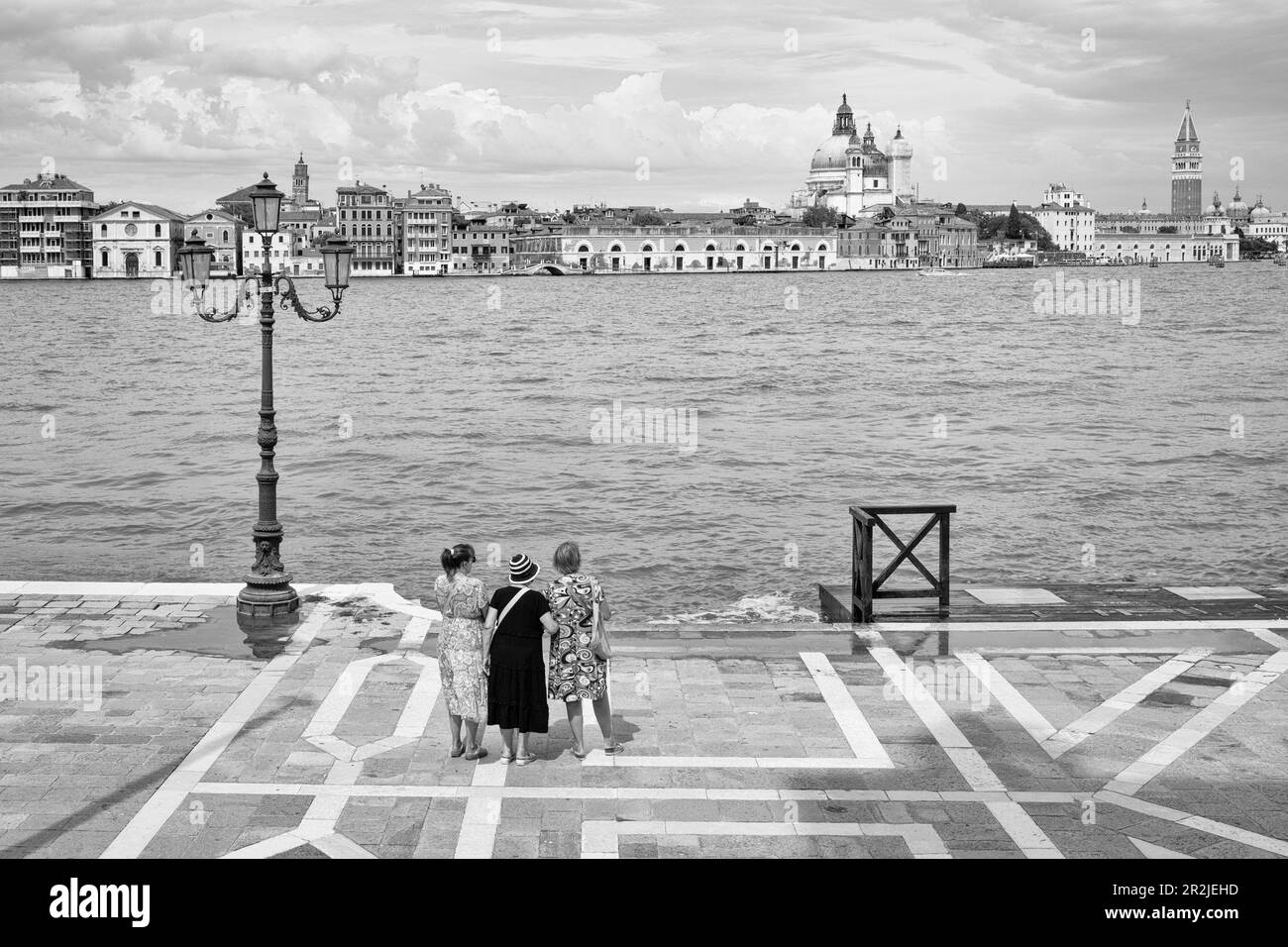 Women looking at San Marco, Giudecca, Venice, Veneto, Italy, Europe Stock Photo