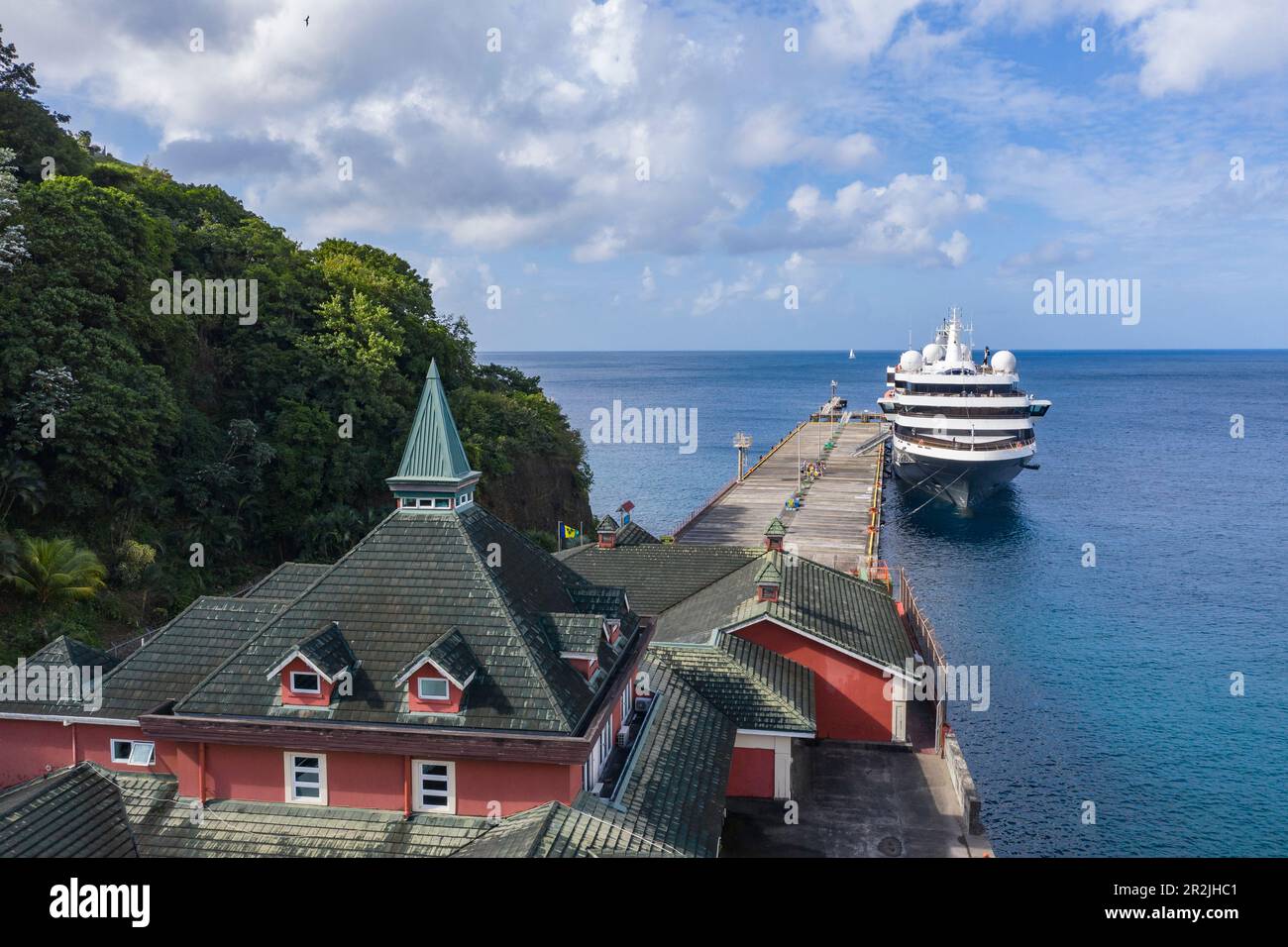 Aerial view of port buildings and expedition cruise ship World Voyager