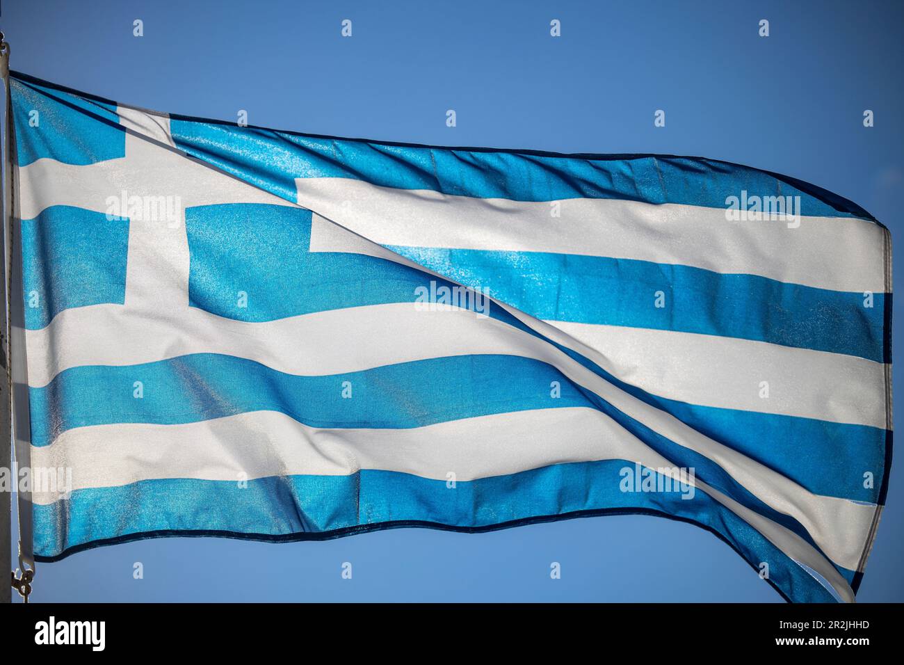 Greek national flag waving in the wind, Itea, Central Greece, Greece, Europe Stock Photo