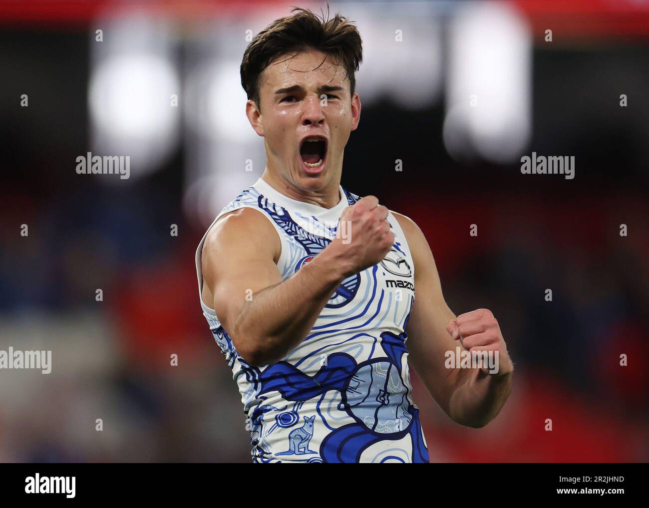 Eddie Ford of the Kangaroos celebrates a goal during the AFL Round 10