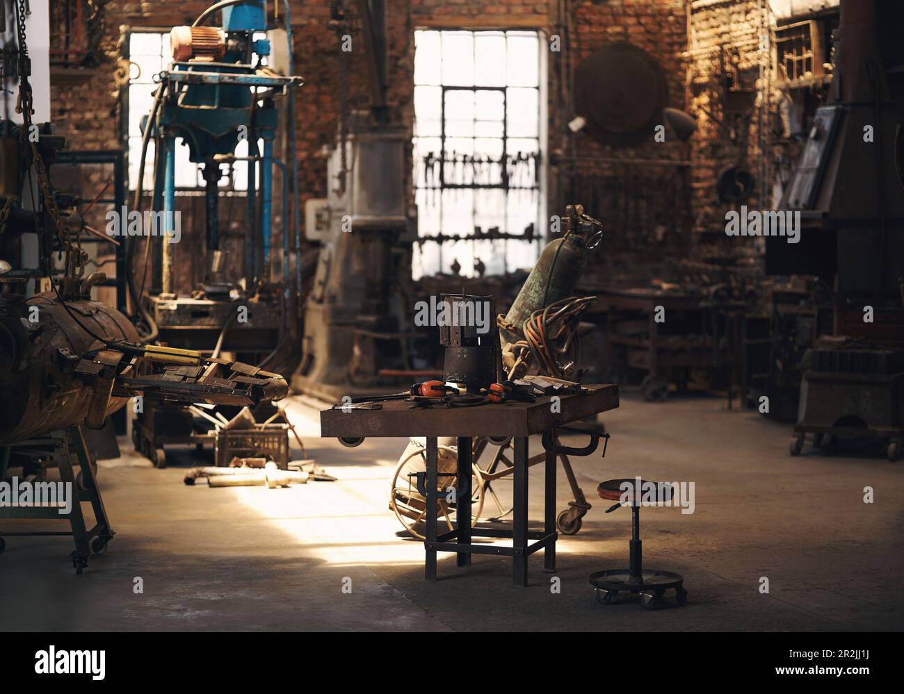 Foundry, and metal tools on desk for industry, manufacturing