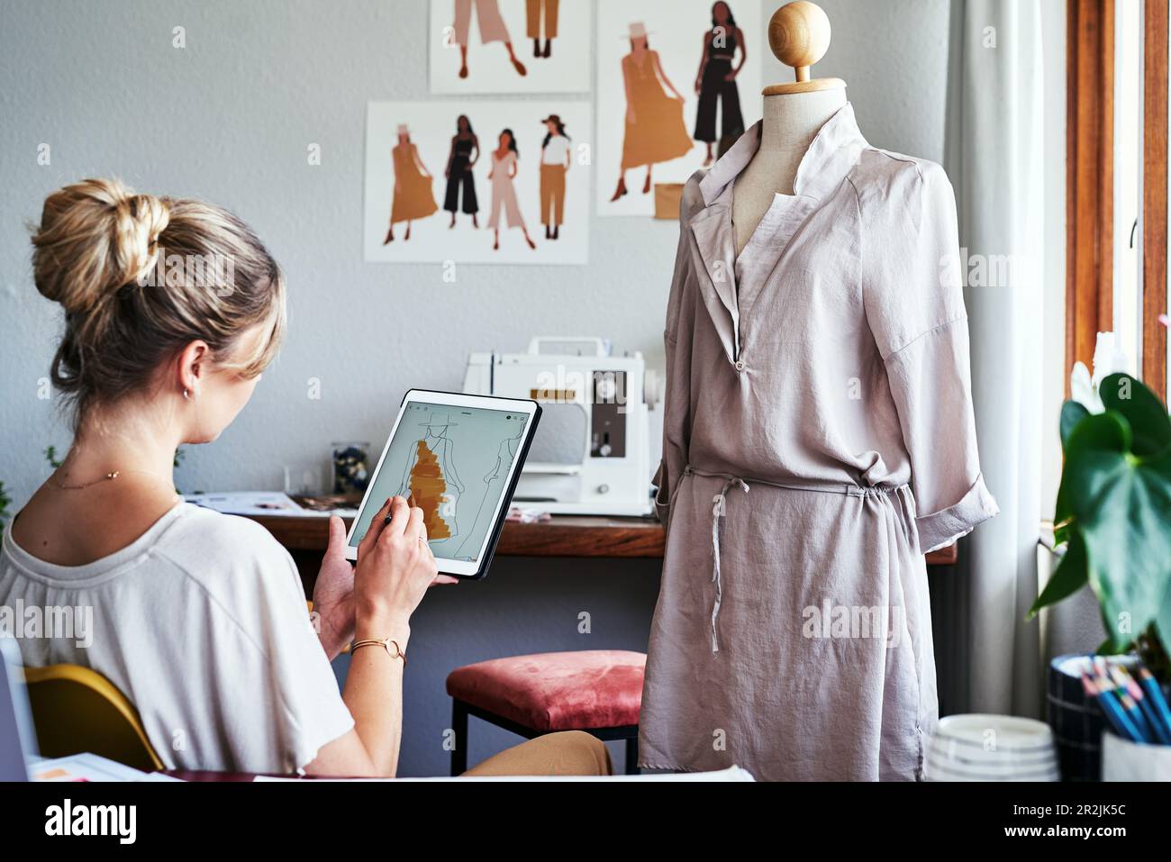 Fashion, woman drawing design on tablet with mannequin, small business ...