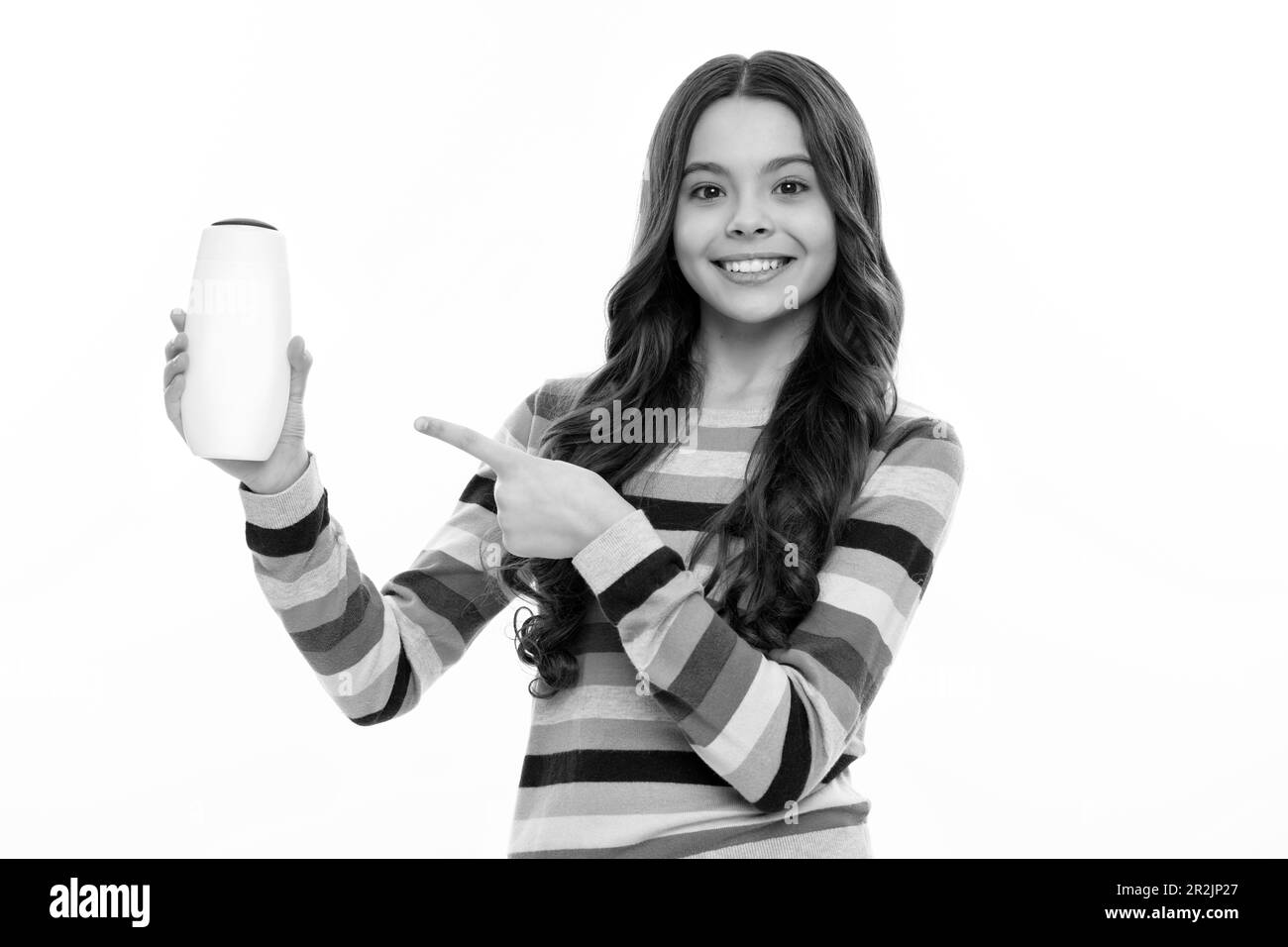 Child teen girl with shampoos conditioners and shower gel. Long hair
