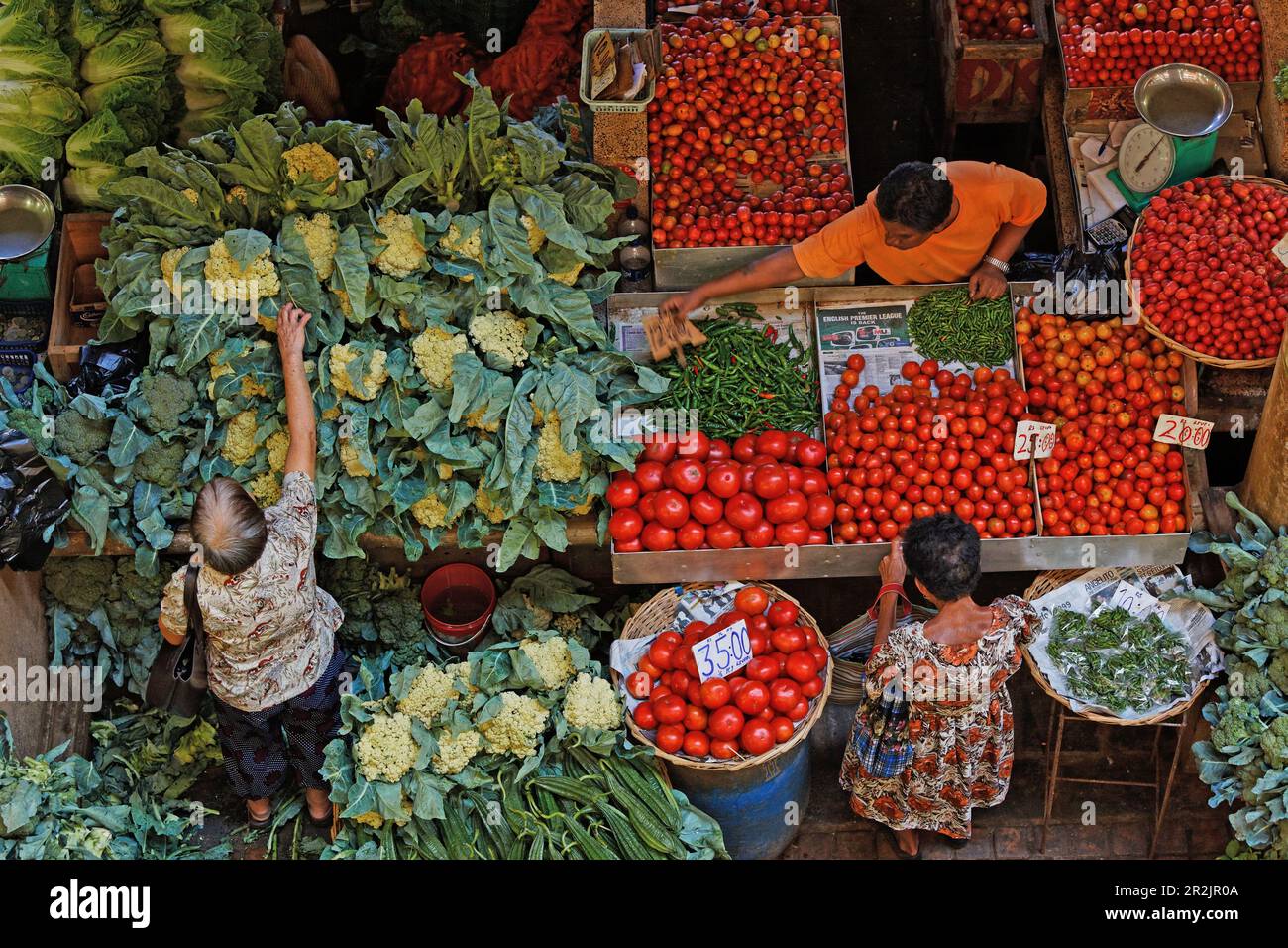 People at stalls in the market hall, Port Louis, Mauritius, Africa Stock Photo