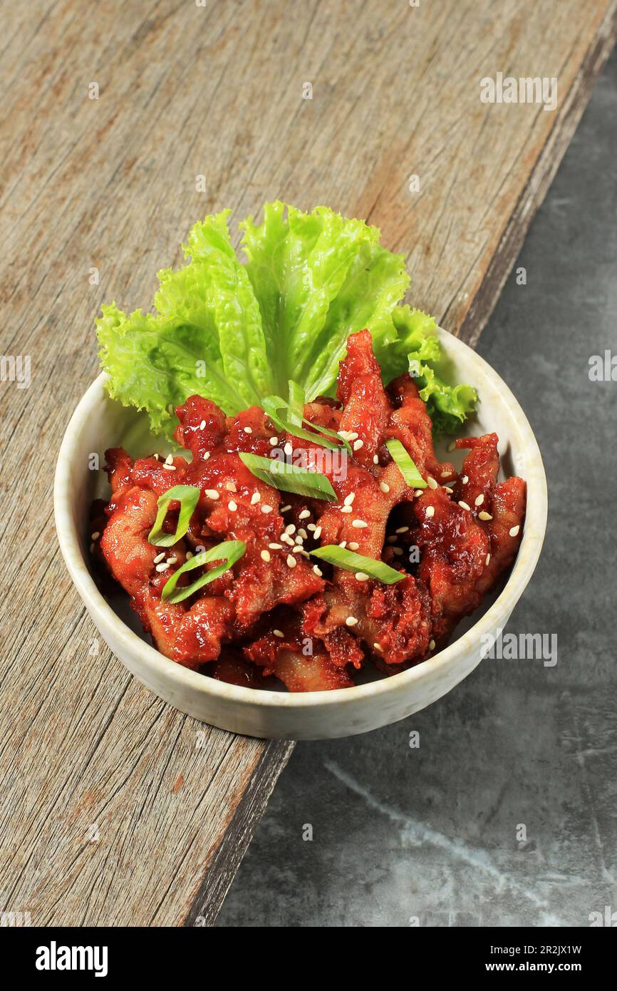 Maeun Dakbal, Korean Style Pub Spicy Chicken Feet with Sesame Seed and Green Onion Topping Stock