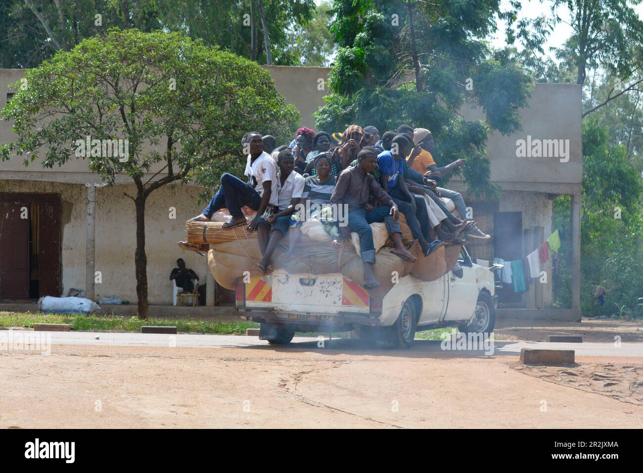 Uganda; Central Uganda in the Nakasongola District; on the road from Kampala to Masindi near Nakitoma; fully loaded pickup bush taxi; Passengers sit o Stock Photo