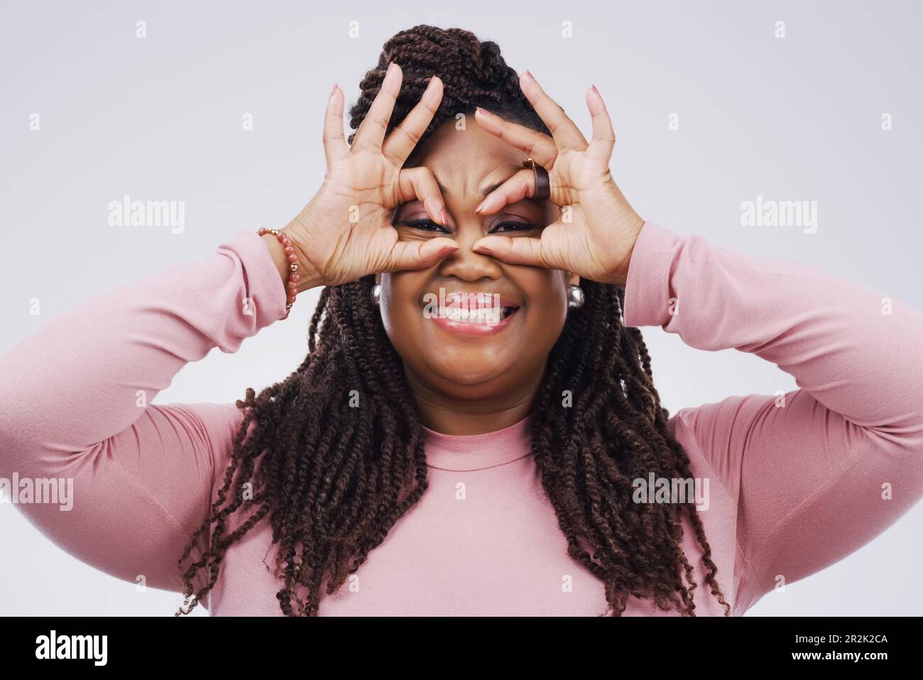 Portrait, funny face and finger mask with a black woman laughing in ...