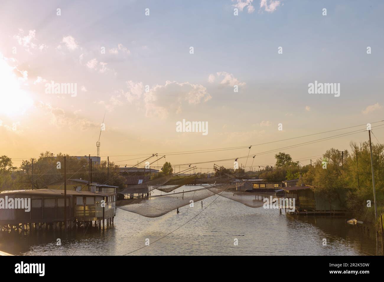 Comacchio, Porto Garibaldi, Canale Torre Rossa with fishermen's huts and outrigger nets Stock Photo