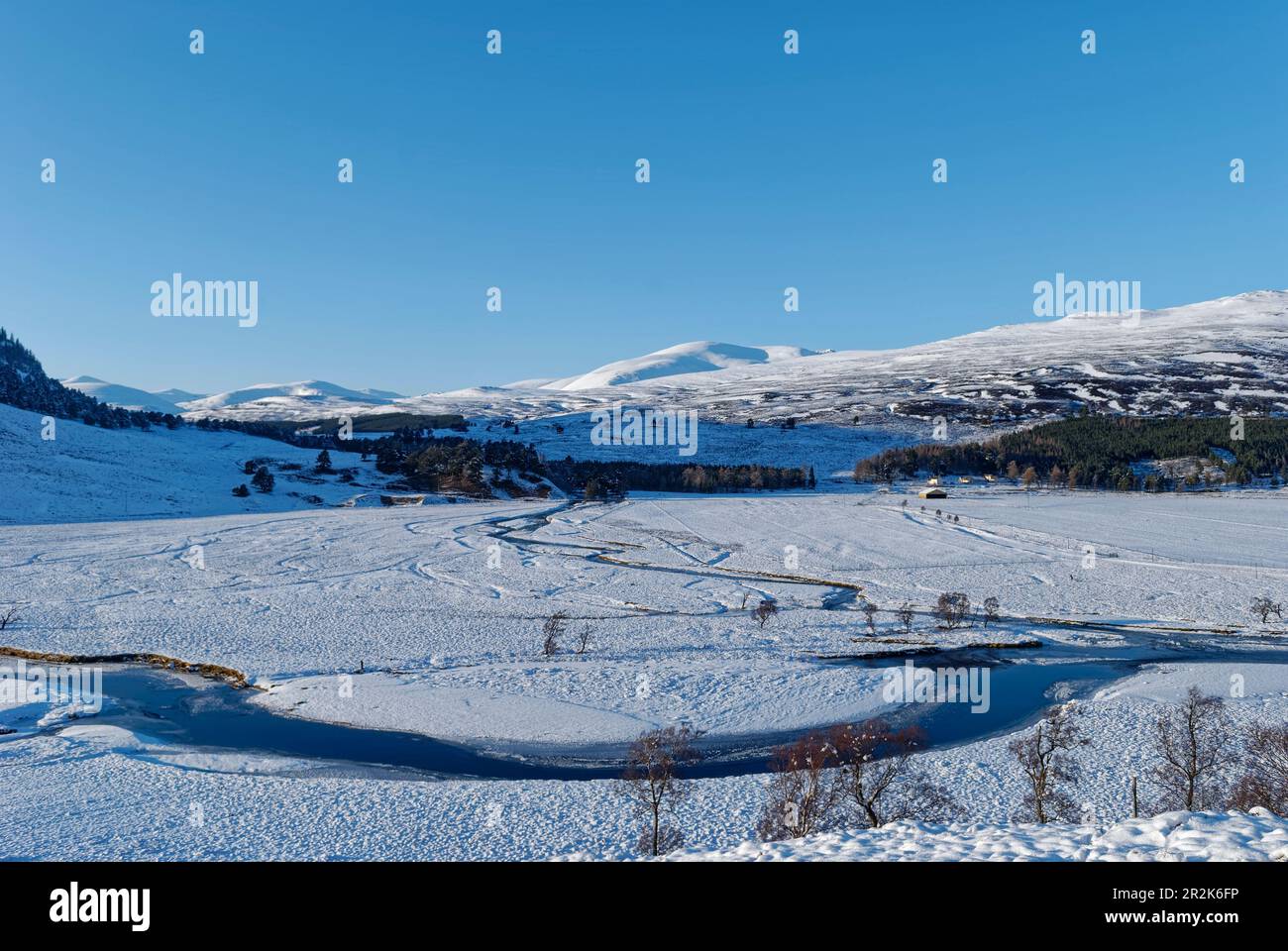 Looking towards the Linn of Quoich and the meandering River Dee near to the highland town of Braemar on a winters day in February. Stock Photo