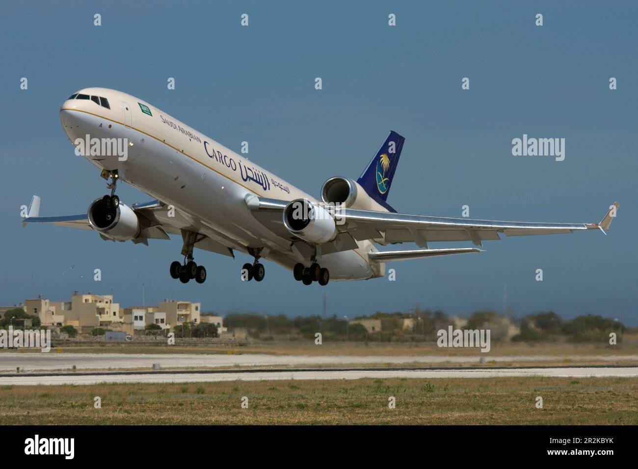 Saudi Arabian Airlines Cargo McDonnell Douglas MD-11F (REG: HZ-ANA) taking off from runway 31. Stock Photo