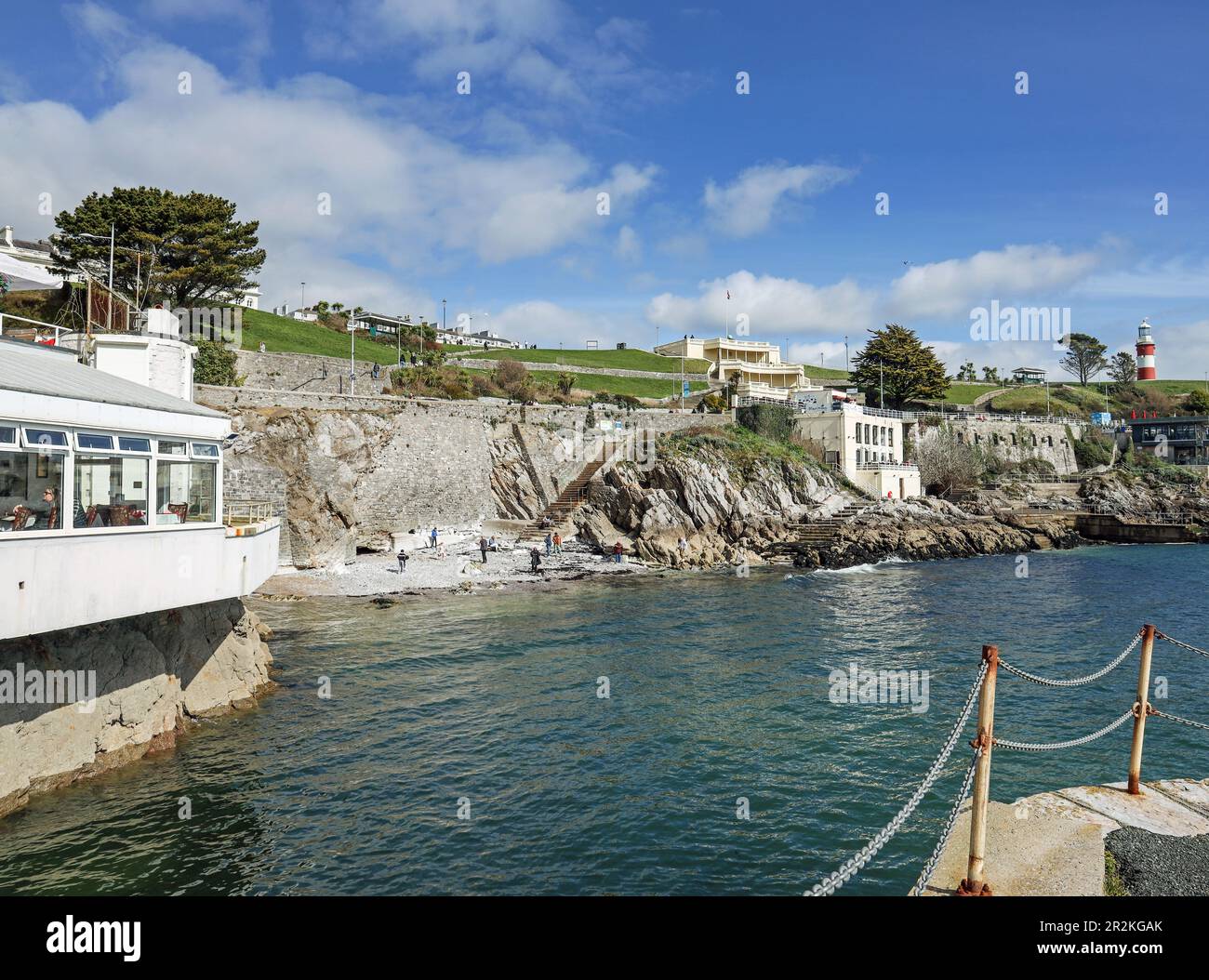 Pebble Beach on Plymouth Hoe has been temporarily closed to the public due to erosion. The small beach near to the Wet Wok restaurant is reached via s Stock Photo