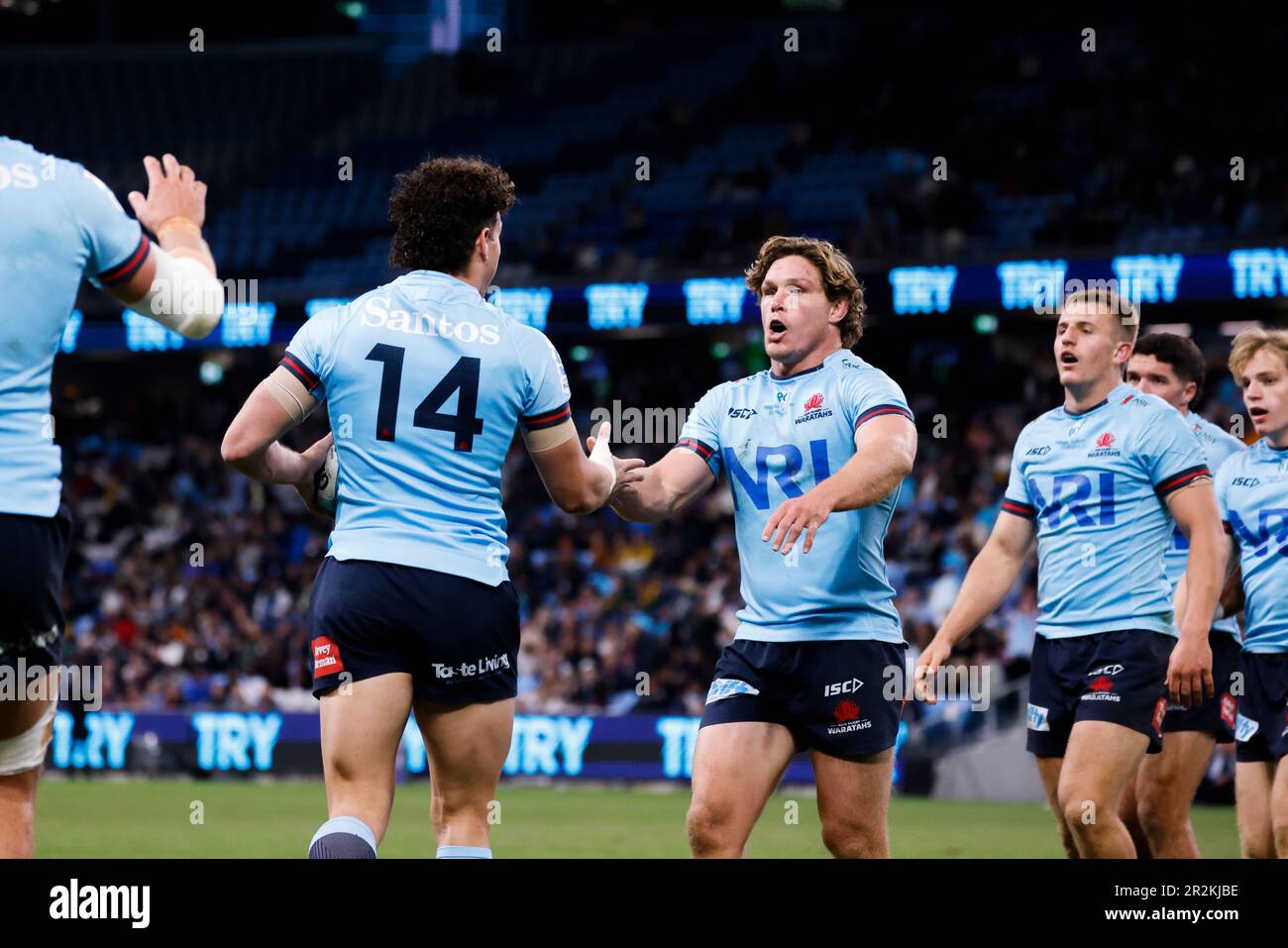 Waratahs celebrate the try of Mark Nawaqanitawase (14) during the Super