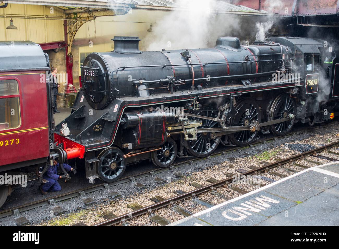 Restored Steam locomotive 75078 hitching up carriages on the Keighley & Worth Valley Railway at Keighley Station in West Yorkshire, England, UK Stock Photo