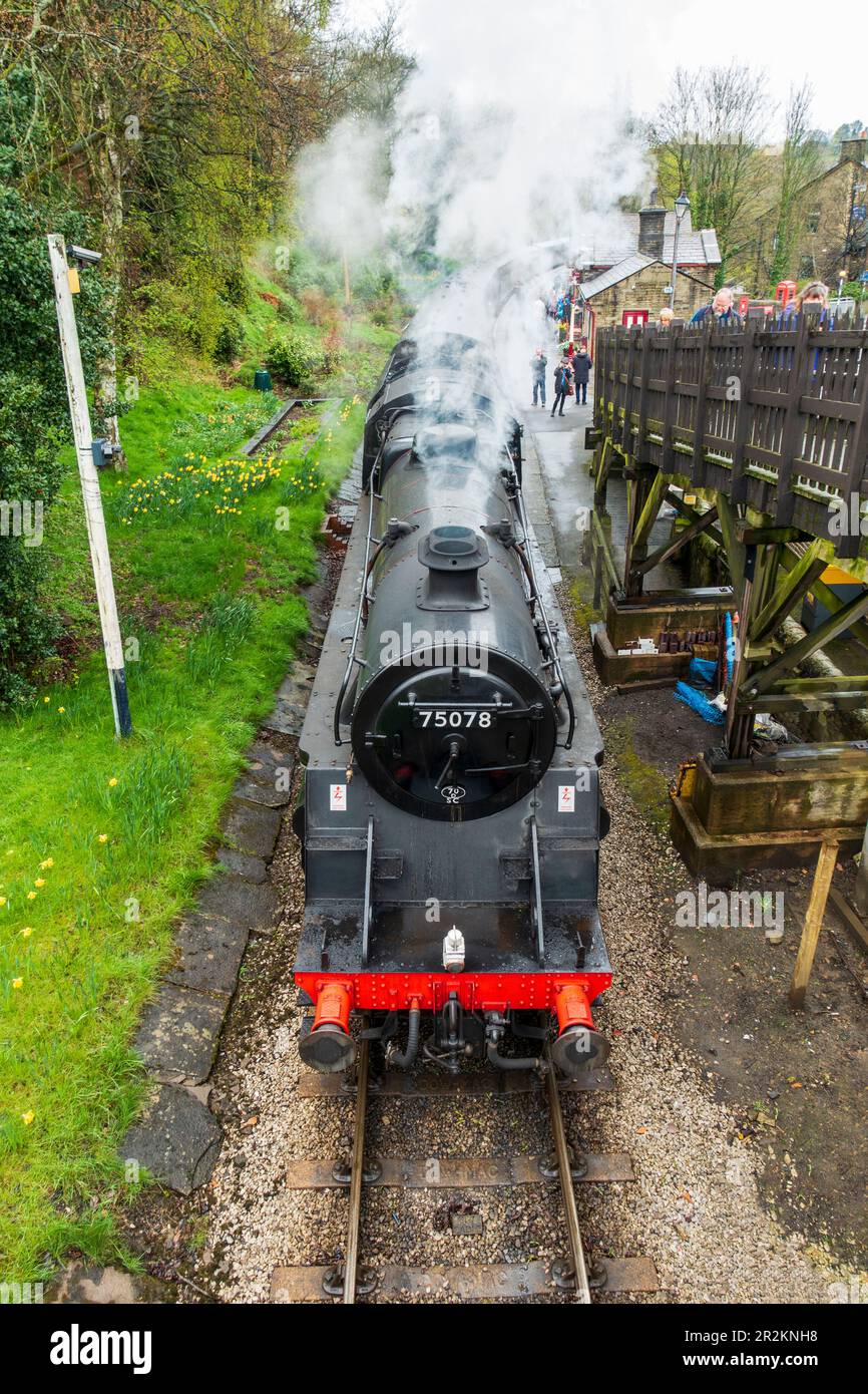 Restored Steam locomotive 75078 on the Keighley & Worth Valley Railway departing Haworth Station in West Yorkshire, England, UK Stock Photo