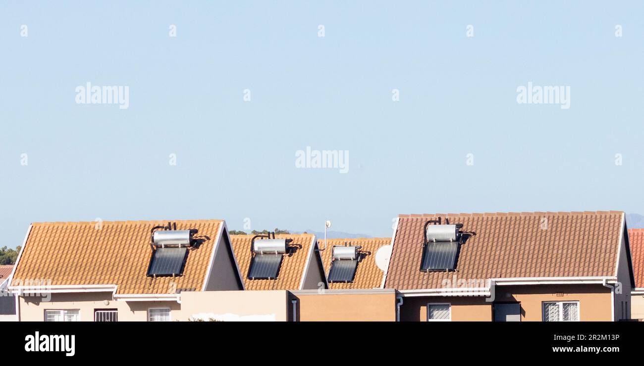 Rooftop solar hot water geysers on houses in a lower housing