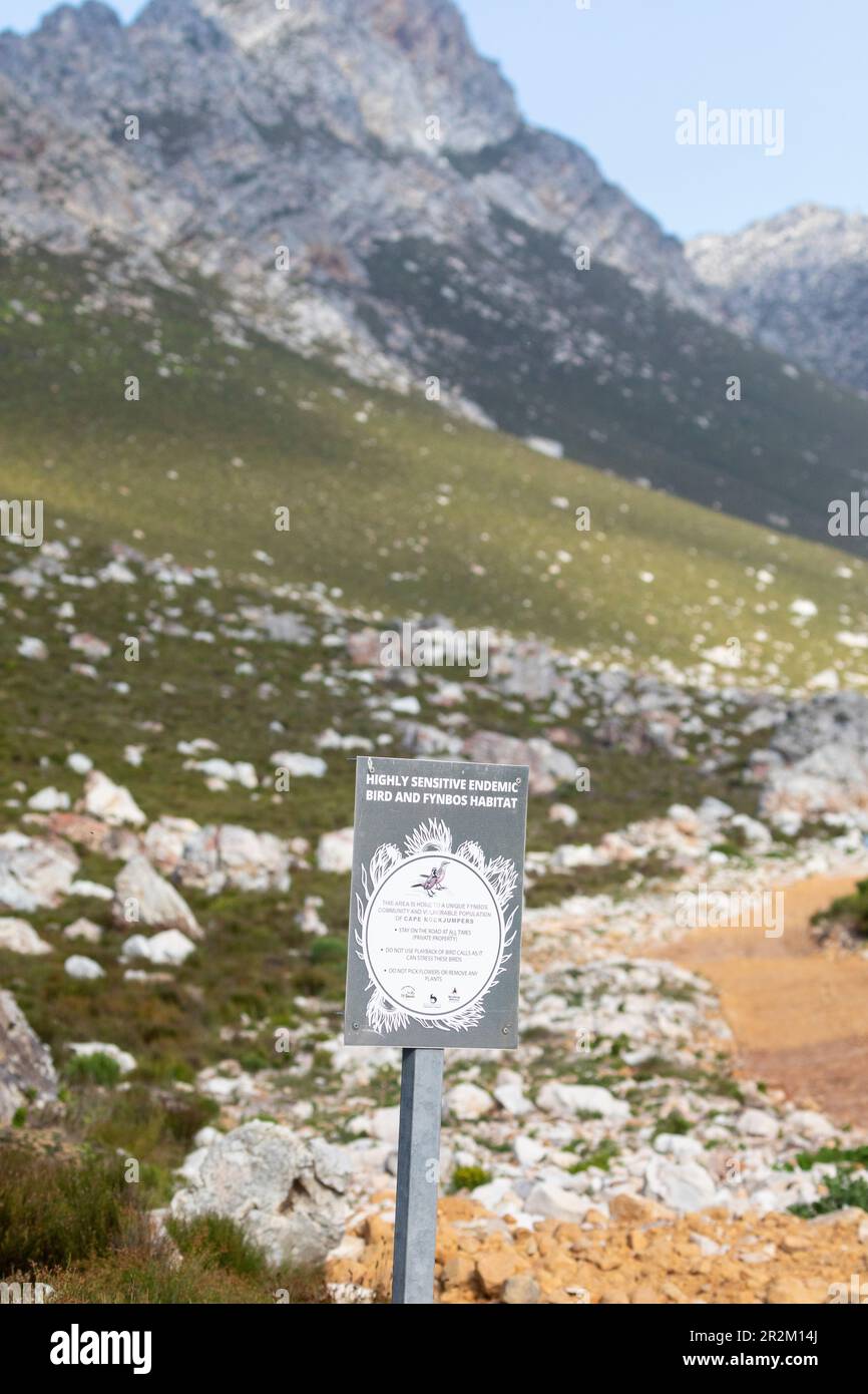 Signs protecting the Cape Rockjumper and its mountain fynbos habitat at Rooi-Els , Western Cape, South Africa, a popular birding spot Stock Photo