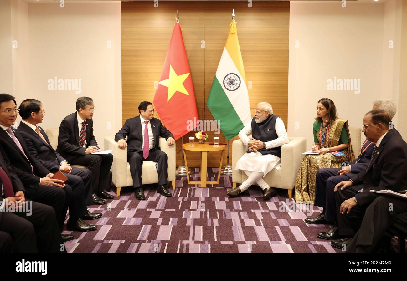 Hiroshima, Japan. 20th May, 2023. Indian Prime Minister Narendra Modi, right, during a bilateral meeting with Vietnamese Prime Minister Pham Minh Chinh, left, on the sidelines of the G7 Summit meeting at the Grand Prince Hotel, May 20, 2023 in in Hiroshima, Japan. Credit: Pool Photo/Press Information Bureau/Alamy Live News Stock Photo