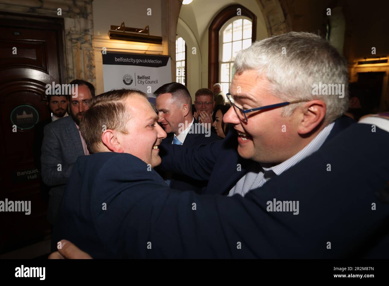 James Lawlor (left) from the DUP who has won a seat in Ormiston at Belfast City Hall during in the Northern Ireland council elections. Picture date: Saturday May 20, 2023. Stock Photo