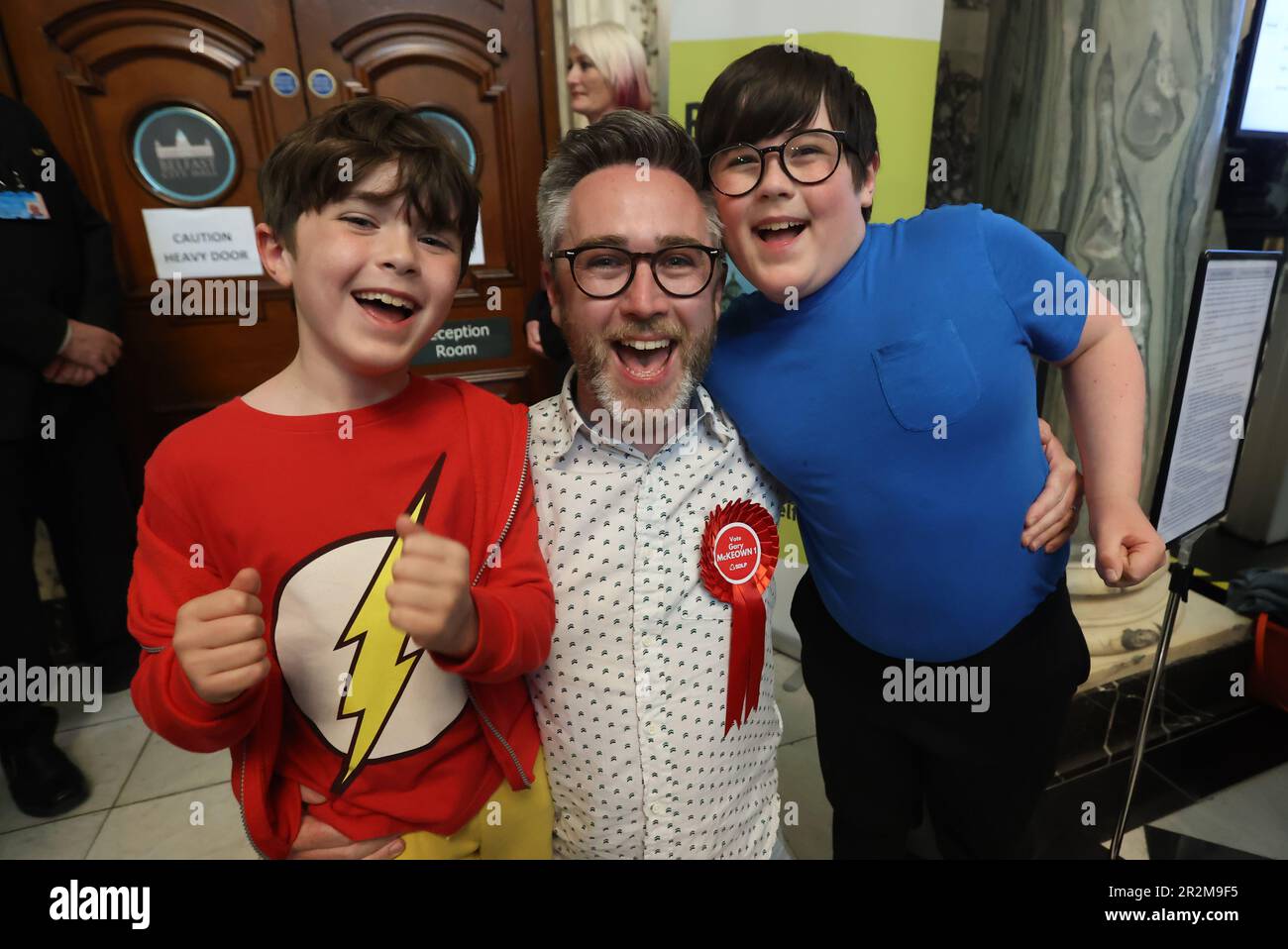 Gary McKeown from the SDLP with sond Thomas and James at Belfast City Hall during in the Northern Ireland council elections. Picture date: Saturday May 20, 2023. Stock Photo