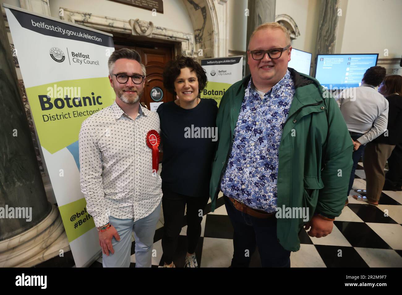 Gary McKeown (left) with Claire Hanna and Seamus de Faoite from the SDLP at Belfast City Hall during in the Northern Ireland council elections. Picture date: Saturday May 20, 2023. Stock Photo