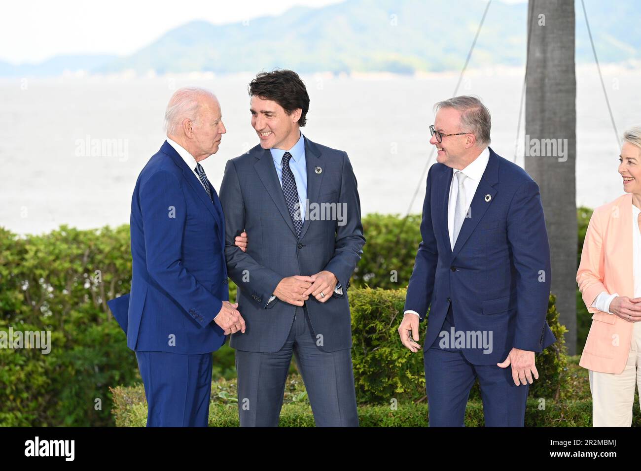 Hiroshima, Japan. 20th May, 2023. U.S. President Joe Biden, left, jokes with Canadian Prime Minister Justin Trudeau, center, as Australian Prime Minister Anthony Albanese, 2nd right, and European Commission President Ursula von der Leyen, right, look on following the official family photo of the G7 Summit at the Grand Prince Hotel, May 20, 2023 in in Hiroshima, Japan. Credit: Pool Photo/G7 Hiroshima/Alamy Live News Stock Photo
