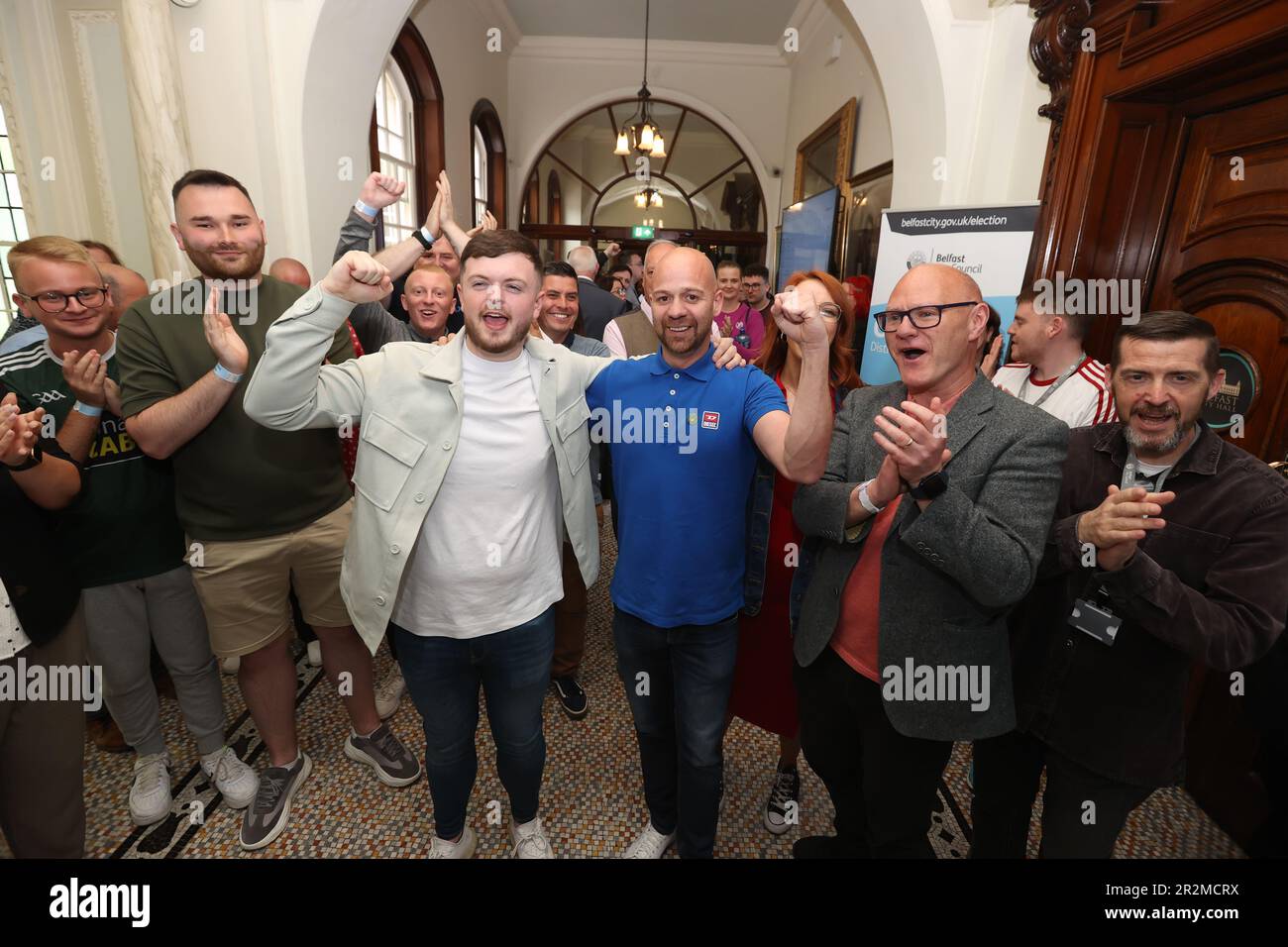 Caoimhin McCann (centre left) and Joe Duffy (centre right) from Sinn Fein at Belfast City Hall during in the Northern Ireland council elections. Picture date: Saturday May 20, 2023. Stock Photo