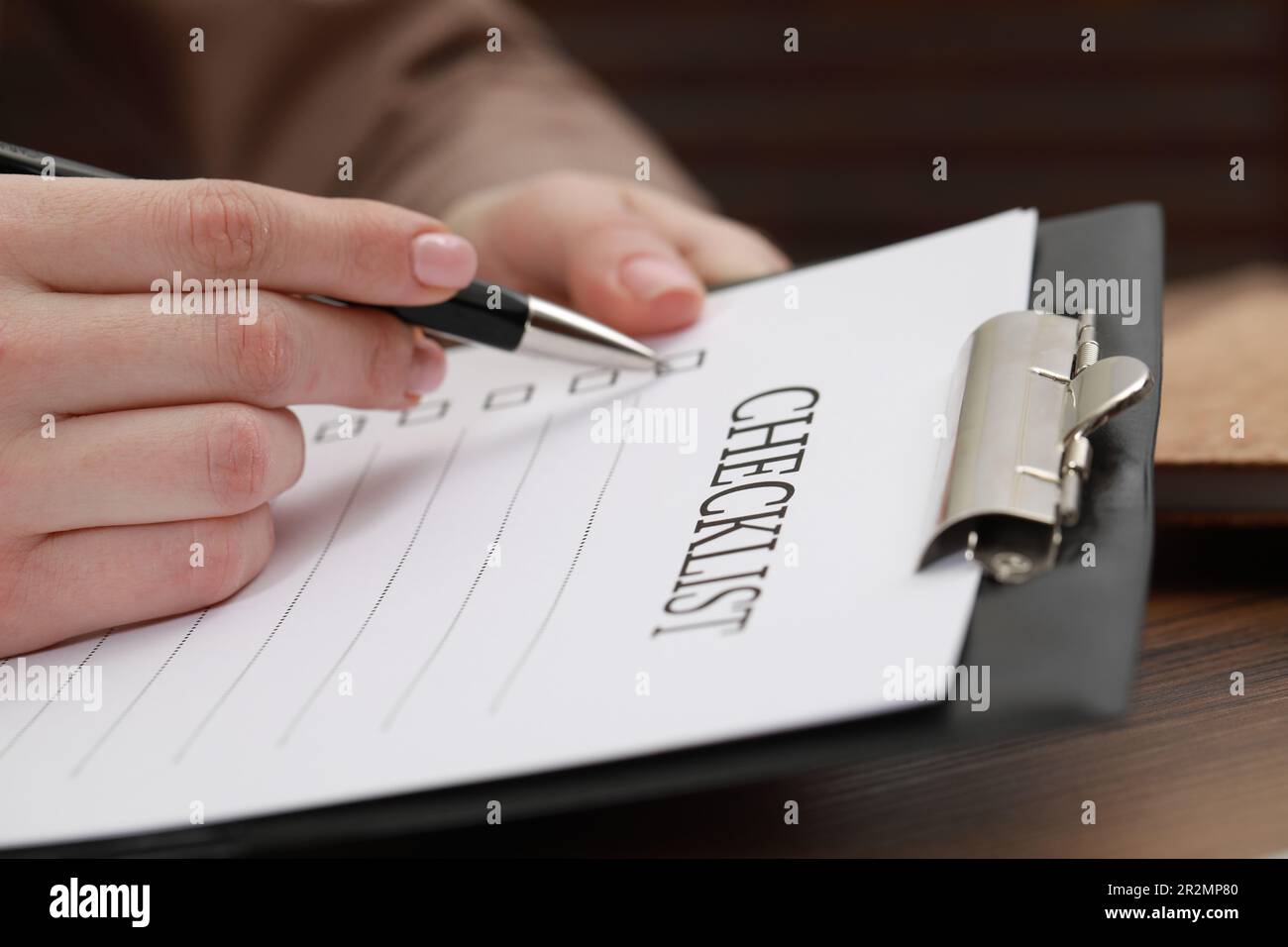 Woman filling checklist table hi-res stock photography and images - Alamy