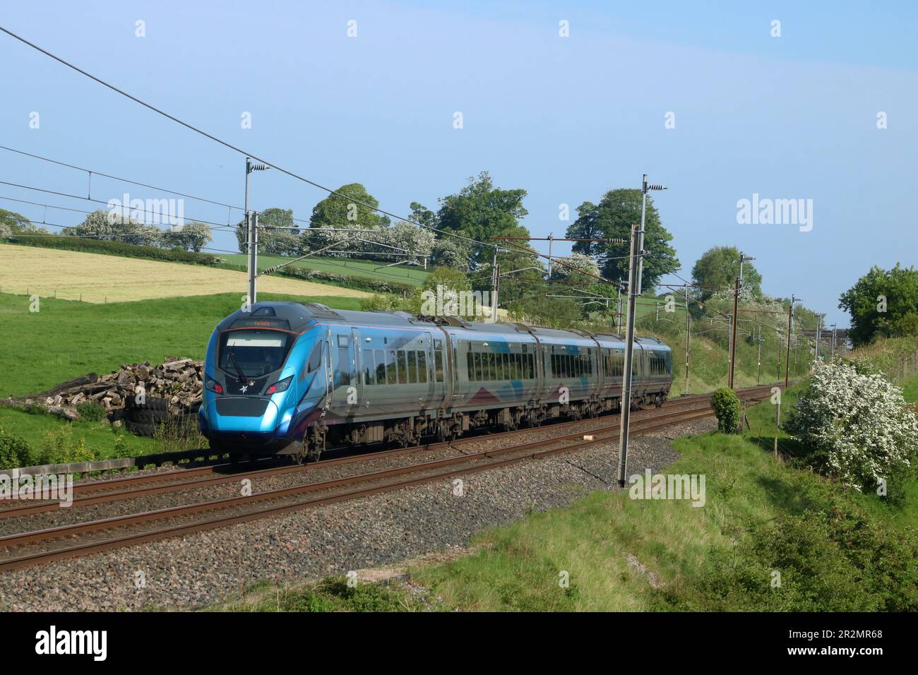 TransPennine Express Civity electric multiple-unit train passing Bay Horse on West Coast Main Line with express passenger service on  20th May 2023. Stock Photo