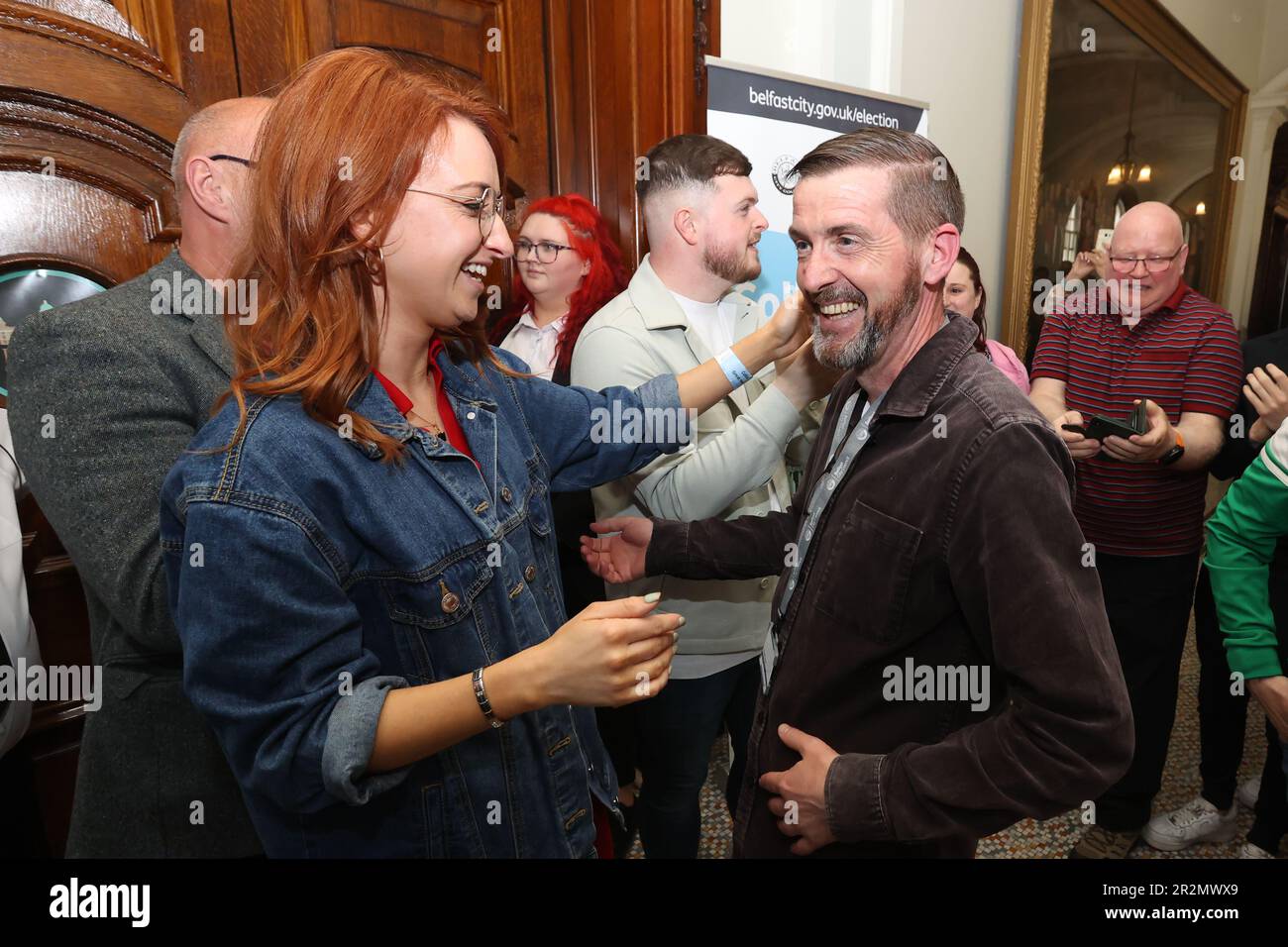Sinn Fein's Matt Garrett (right) celebrates with colleague Cliodhna Nic Bhranair (left) after winning a seat in Collin, in the Northern Ireland council elections at Belfast City Hall. Picture date: Saturday May 20, 2023. Stock Photo