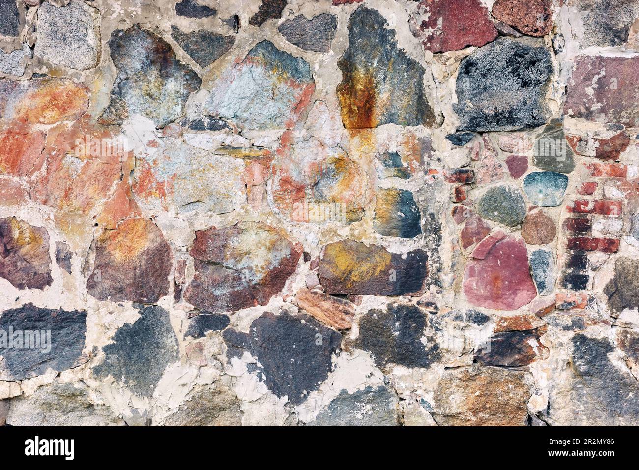 Old rough rock wall, abstract background or texture. Stock Photo