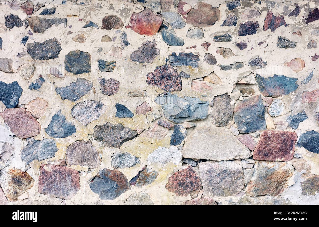 Old rough rock wall, abstract background or texture. Stock Photo