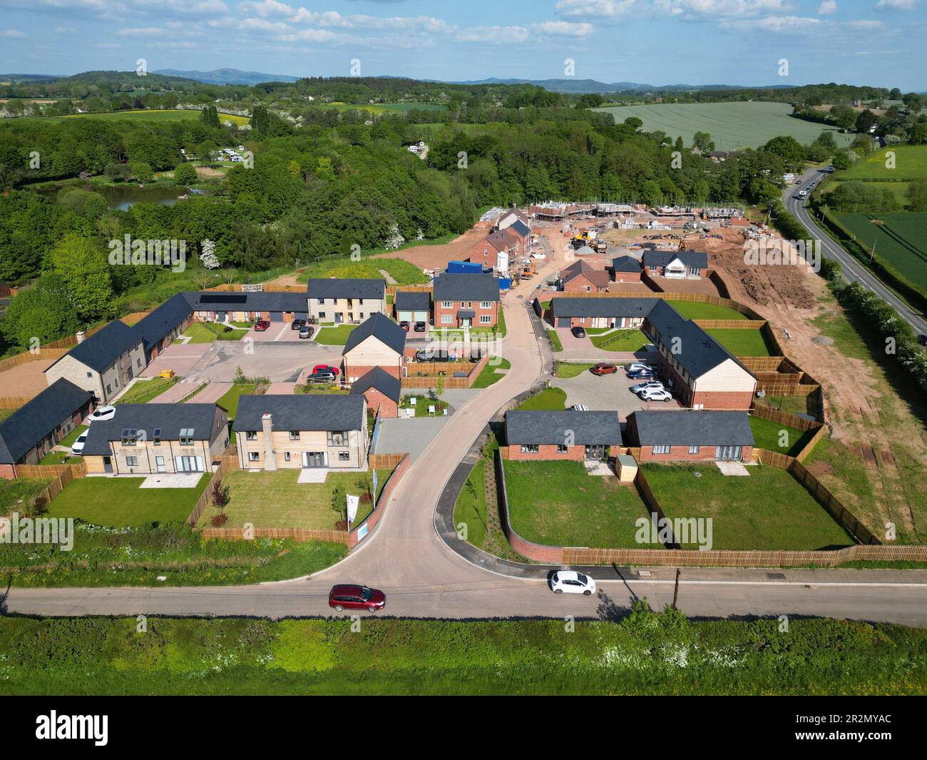 Aerial view of new build housing construction site on former rural land