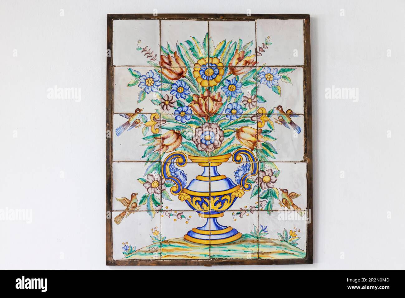 Ubeda, Jaen Province, Andalusia, southern Spain.  Azulejo in National Parador of a handled vase filled with flowers surrounded by birds in flight.  Ub Stock Photo