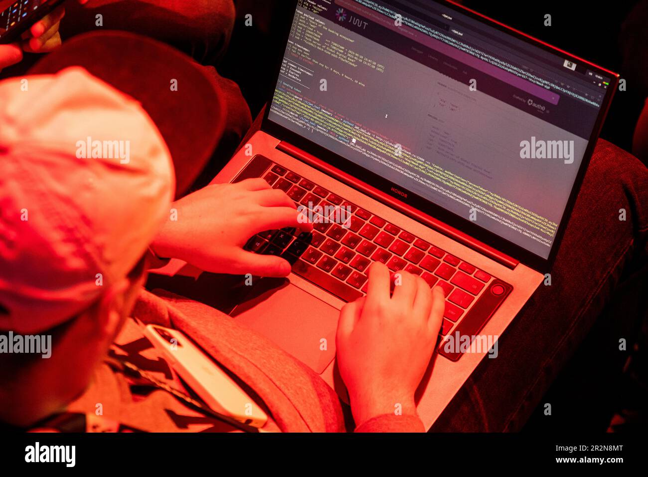 Moscow, Russia. 20th of May, 2023. A programmer writes a code during a cyber battle of professional hackers and defenders of urban information infrastructure of a fictional city in the Standoff pavilion of the Positive Hack Days cyber festival in Gorky Park in Moscow, Russia Stock Photo