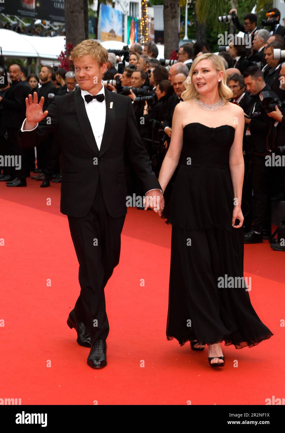 Jesse Plemons, left, and Kirsten Dunst pose for photographers upon