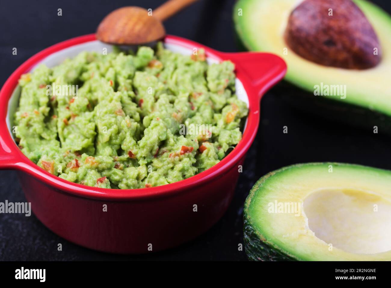 Guacamole in a bowl on a wooden Stock Photo