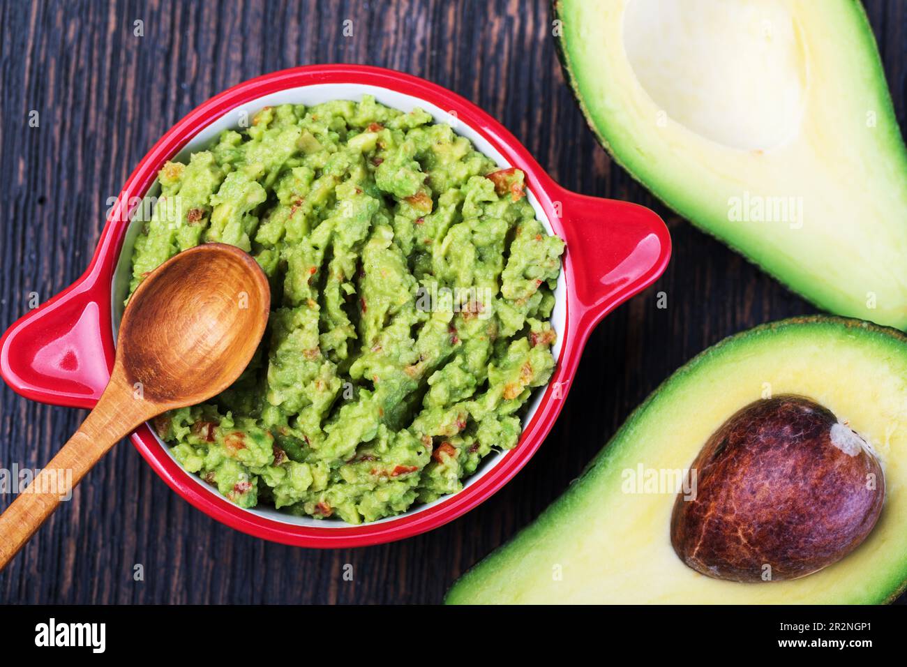 Guacamole in a bowl on a wooden Stock Photo