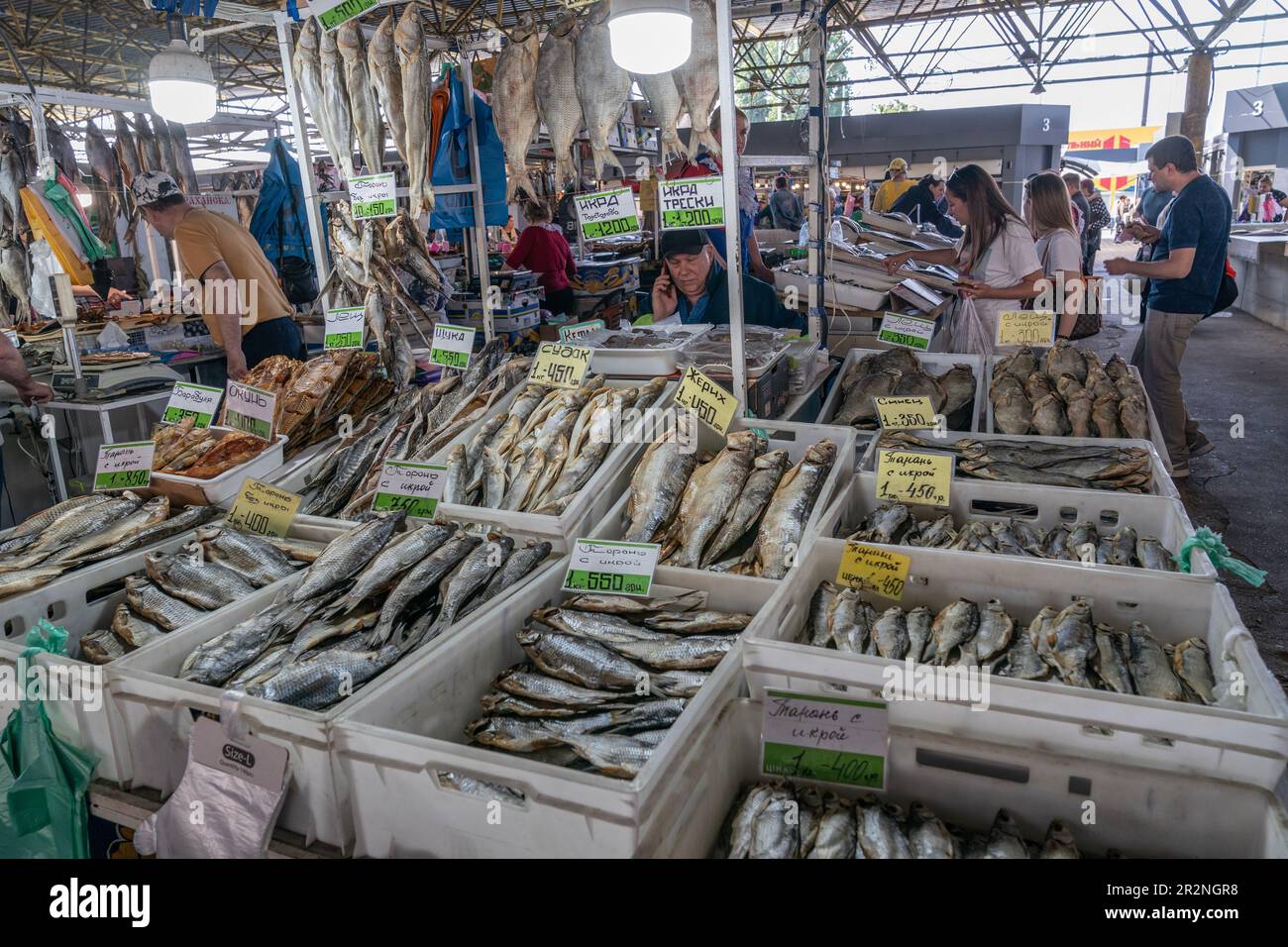 Vendor is selling salted dried fish on famous farmer market Pryvoz
