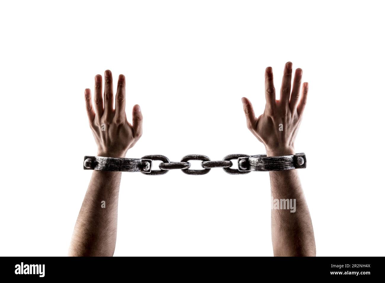 Shackled hands isolated on white background with clipping path Stock Photo