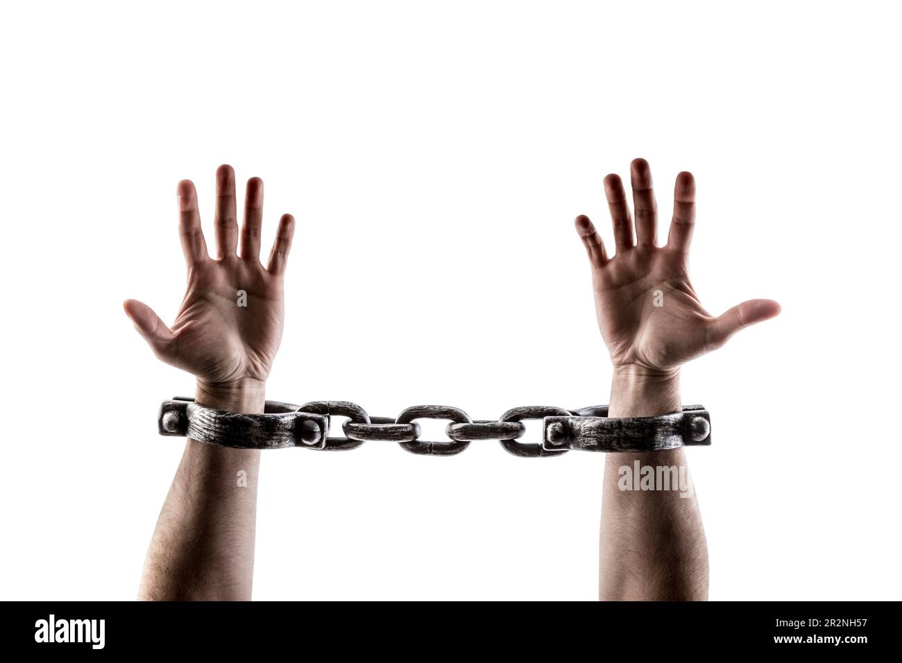 Shackled hands isolated on white background with clipping path Stock Photo