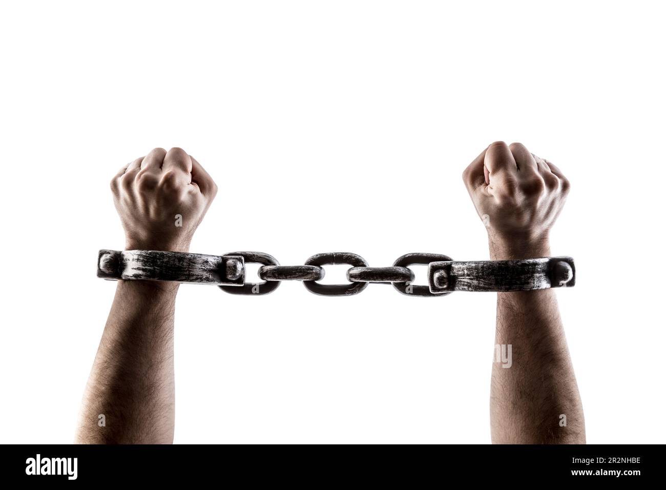 Shackled hands isolated on white background with clipping path Stock Photo